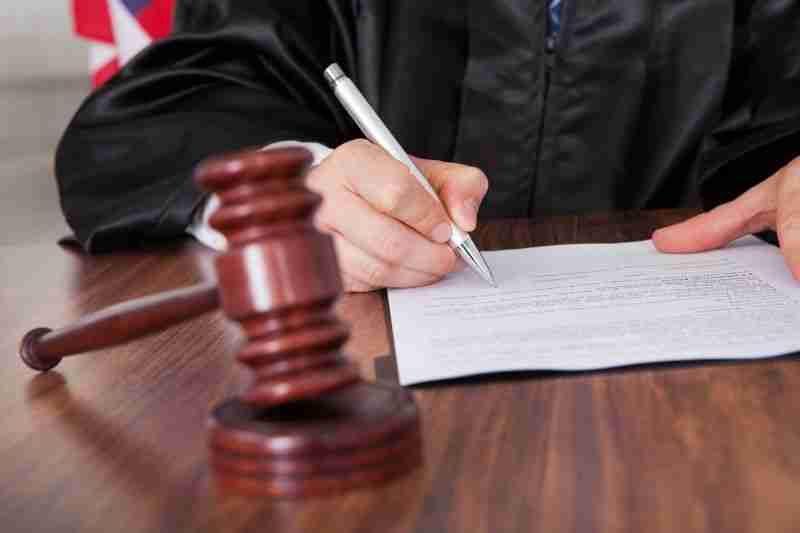 Judge signing document