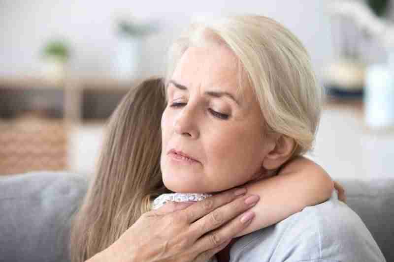 grandmother holding granddaughter