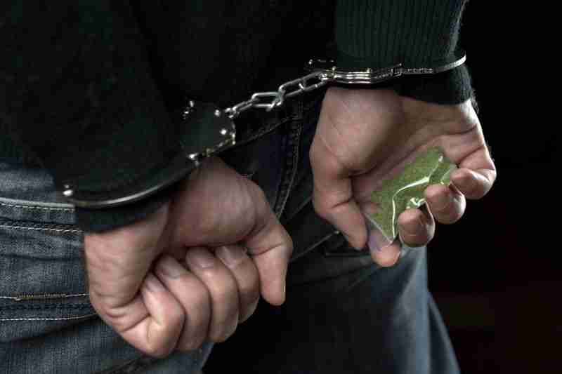 handcuffed with drugs