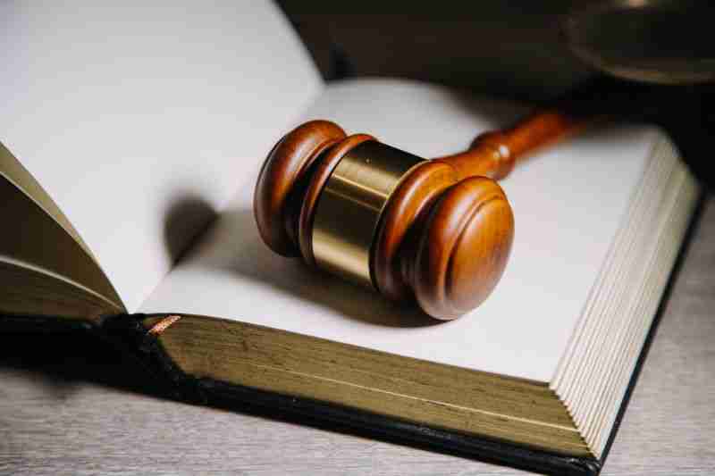 gavel with blank law book