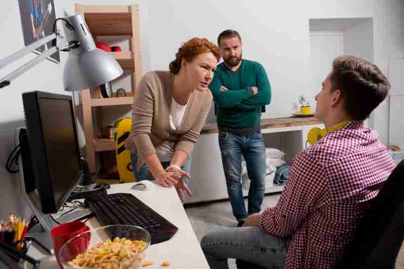 defiant teenager looking at parent