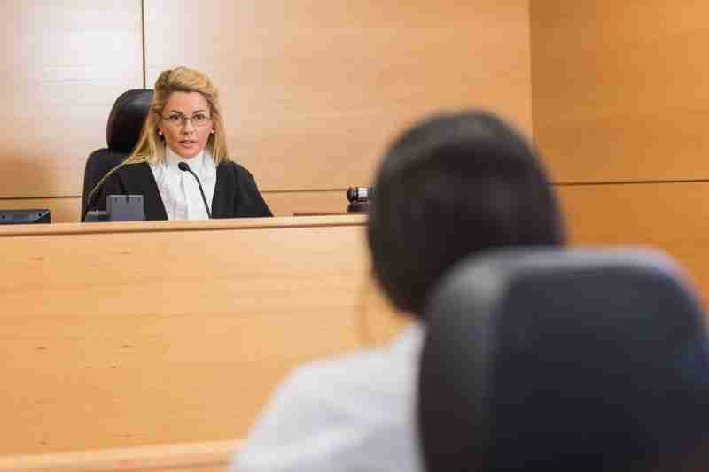 judge looking at mother