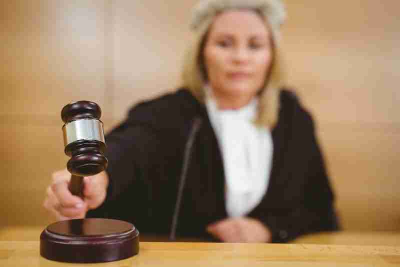 blurred judge pounding gavel
