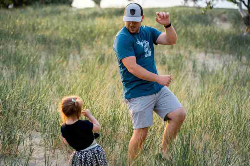 father dancing with child