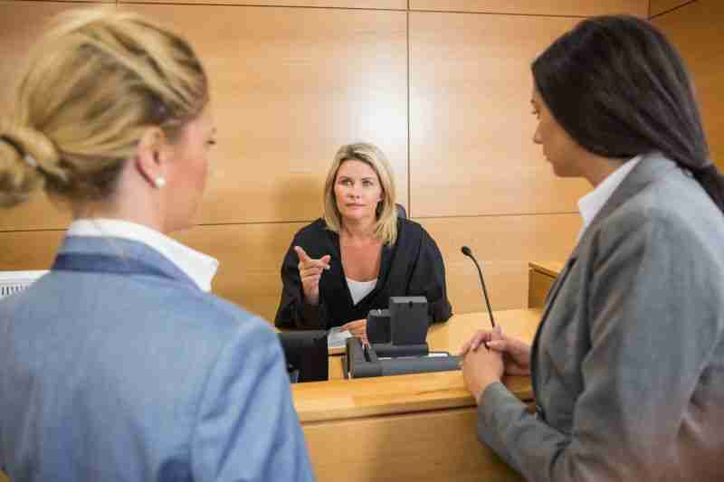 judge pointing at lawyers
