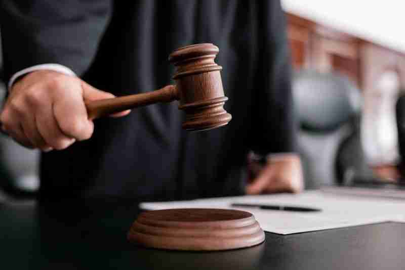 judge standing with gavel