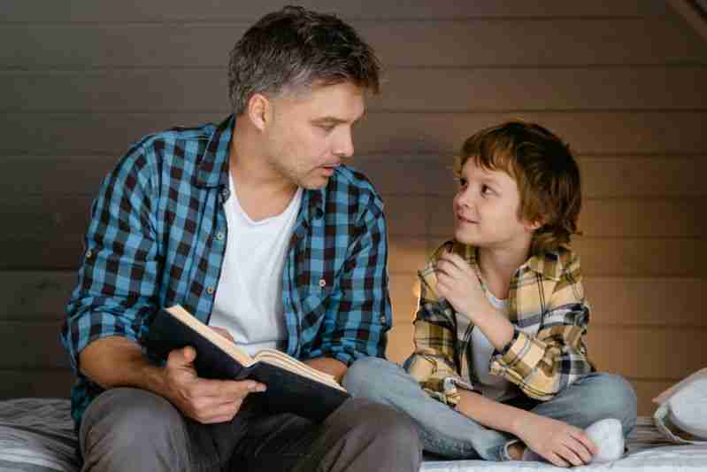 father reading to son