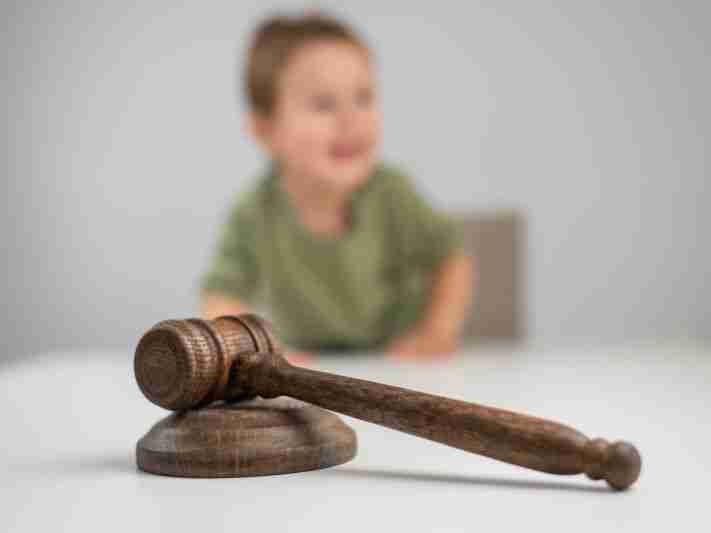 blurred child with gavel