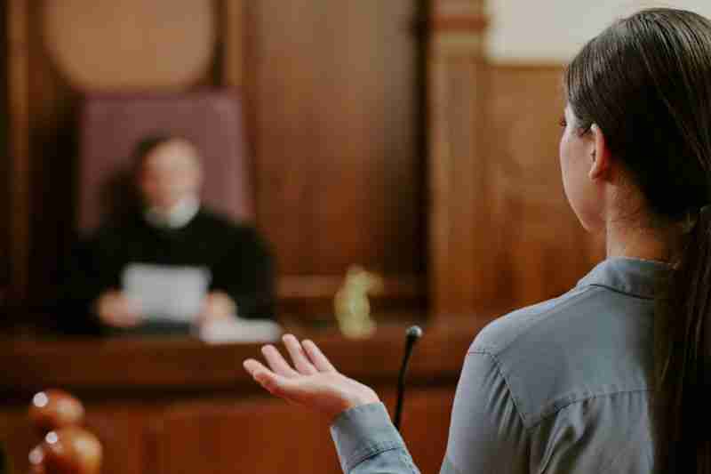 judge looking at woman