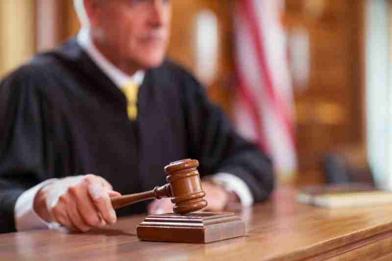 judge with gavel and blurred background